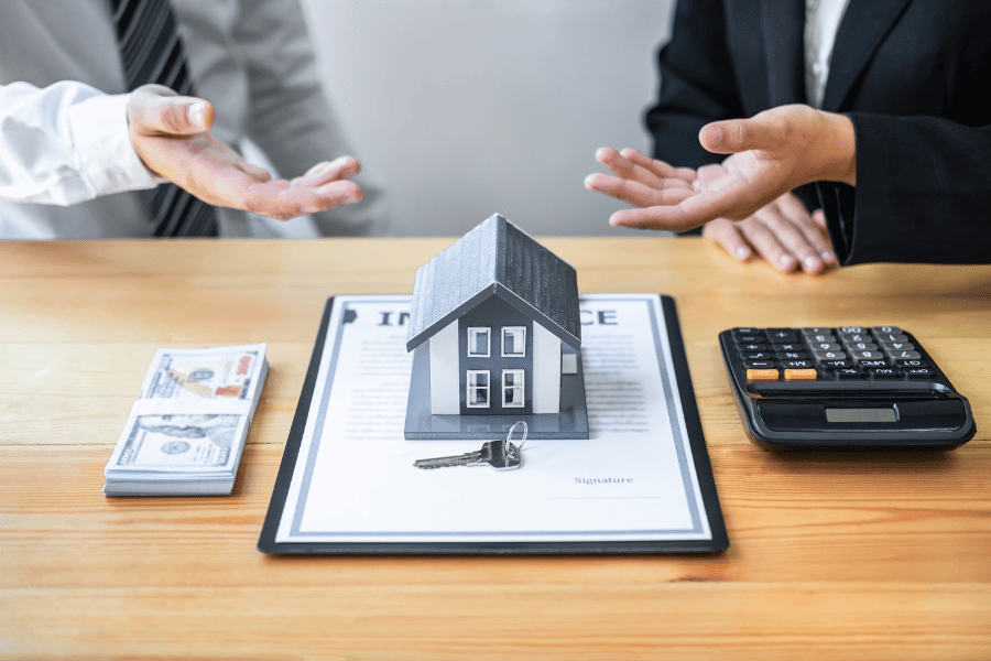home with calculator and money
