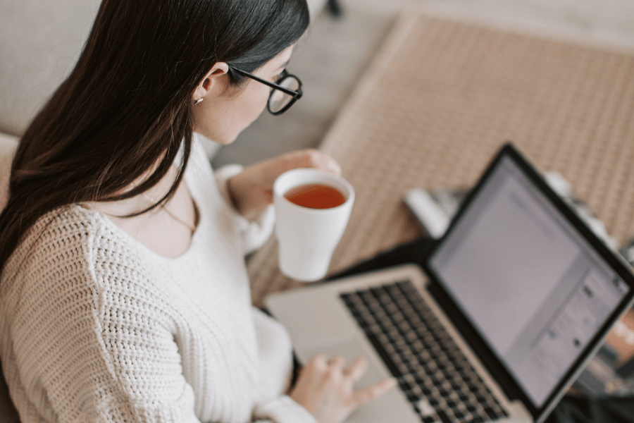 working from home on the computer with a cup of tea