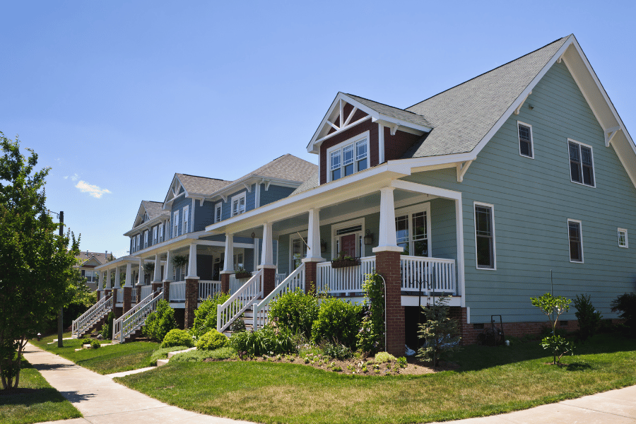 beautiful homes with front porches in a quiet suburban neighborhood