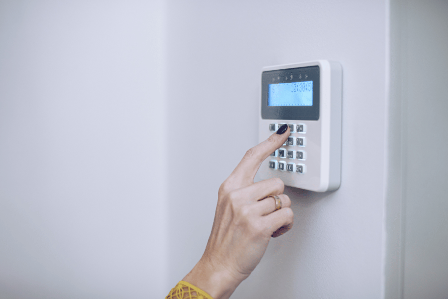 homeowner setting up home security system 