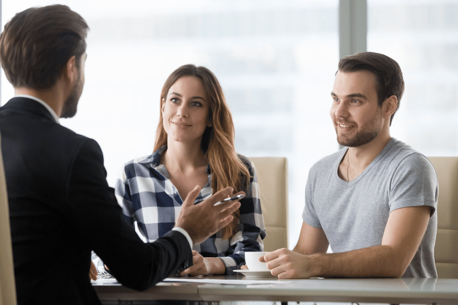 young couple looking to make an offer on a home 