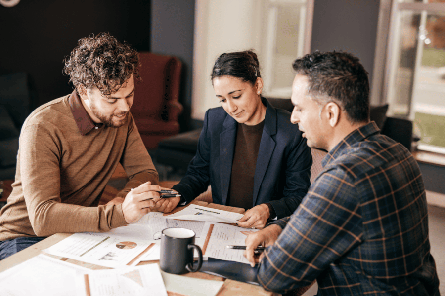 three people discussing home mortgage 