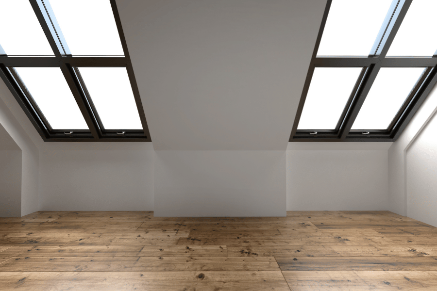  Converted Attic in home with large windows and hardwood floors