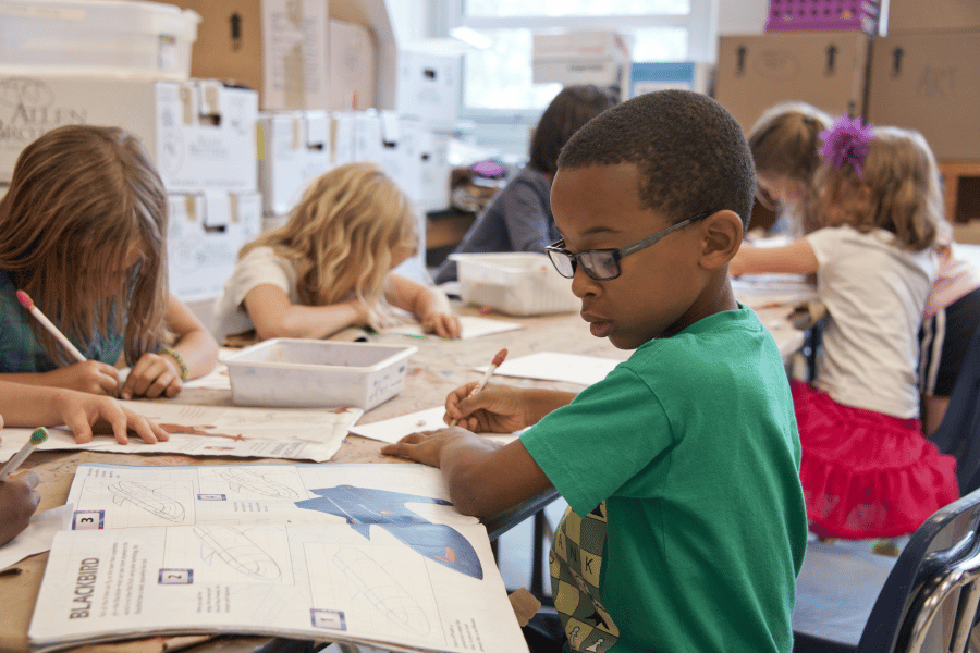 kids at school working in a classroom 