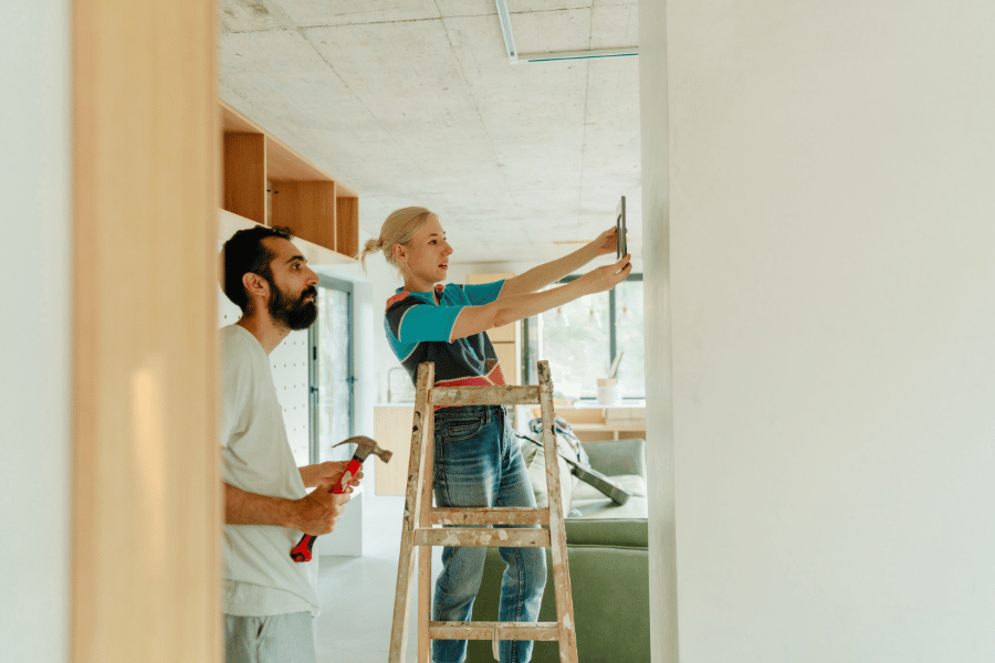 couple working on home improvements at new home