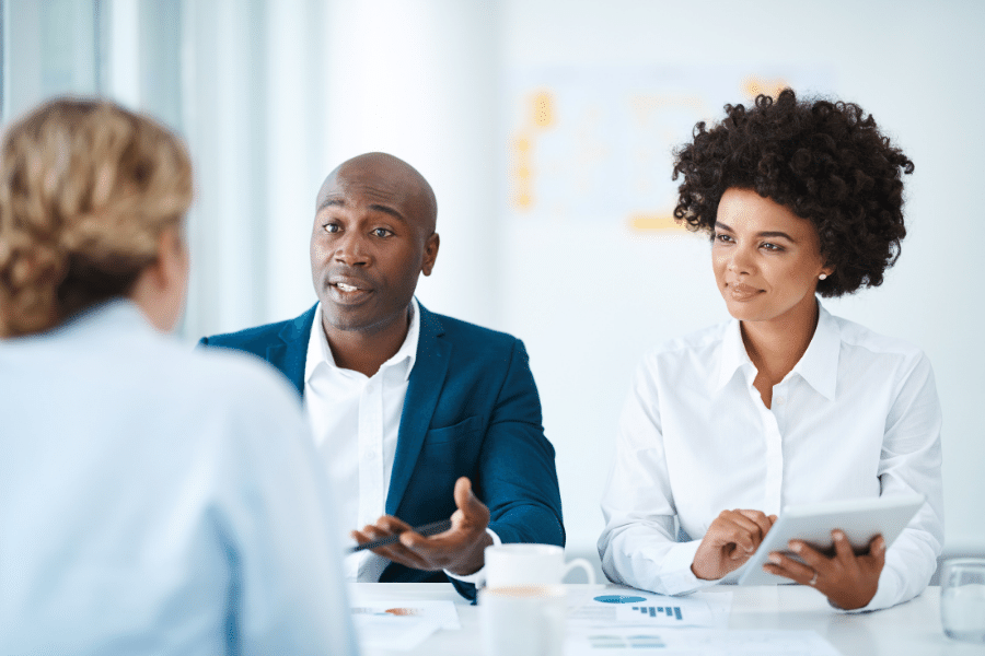 group of people talking and asking questions about real estate