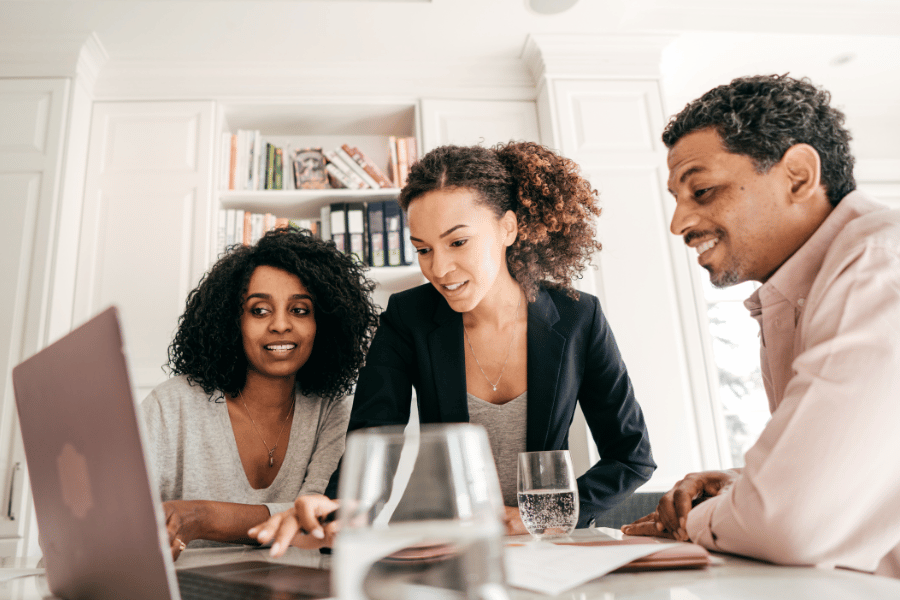 Realtor helping their clients with all the paperwork on home buying