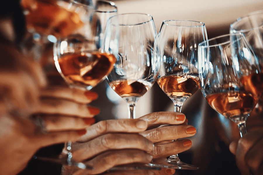 group of friends drinking glasses of wine