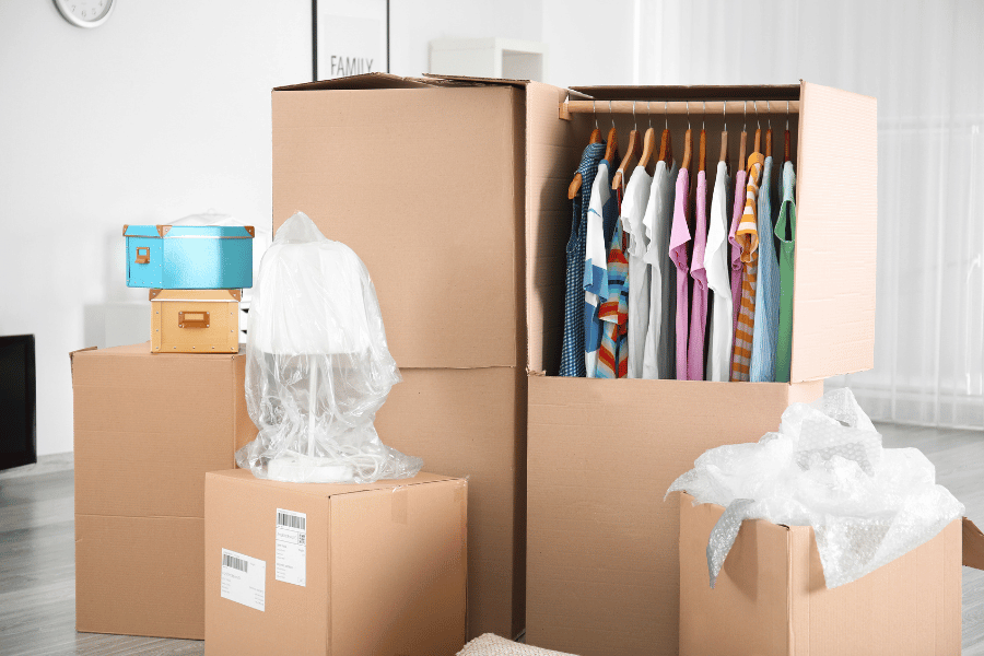 keep clothes on hangers when packing them in wardrobe boxes