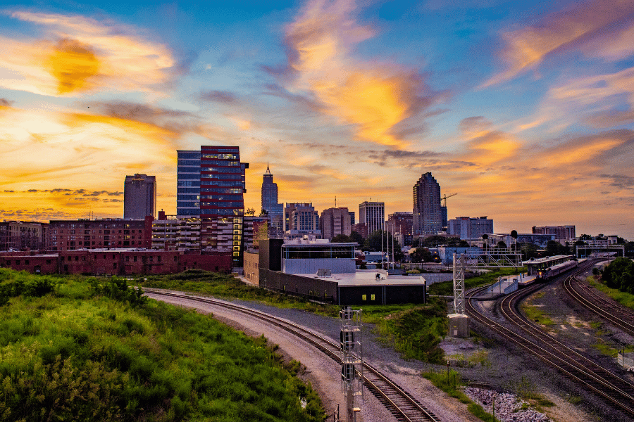 Downtown Raleigh view with orange sunset and buildings in view