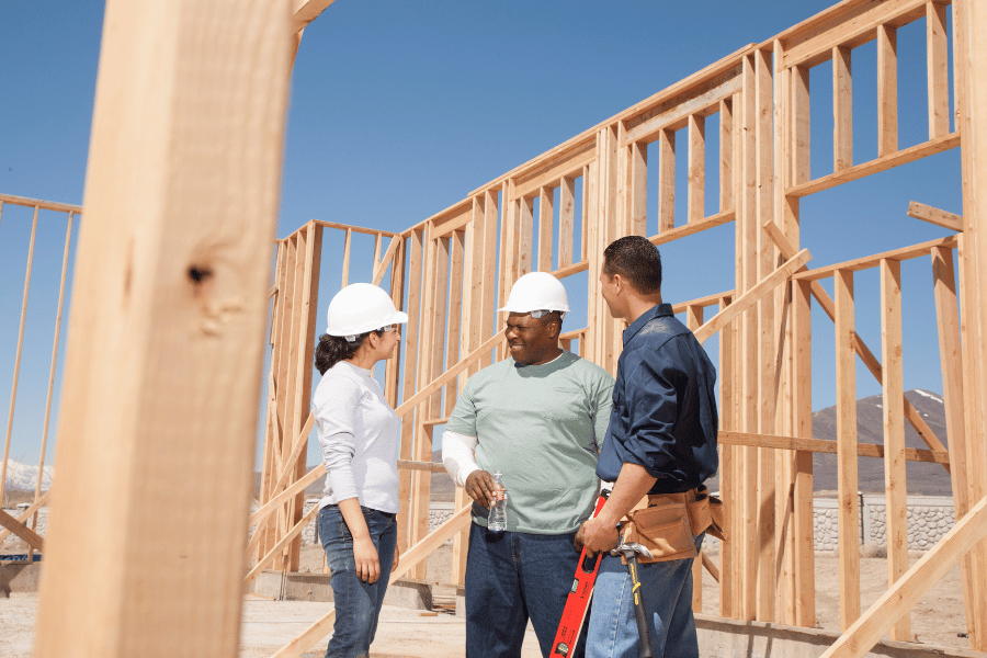 Wokers at the construction site working on custom home