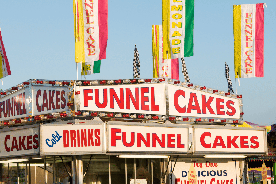 colorful funnel cake stand at the state fair 