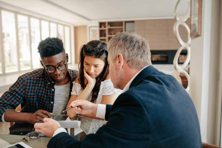 couple talking to a consultant about mortgage insurance
