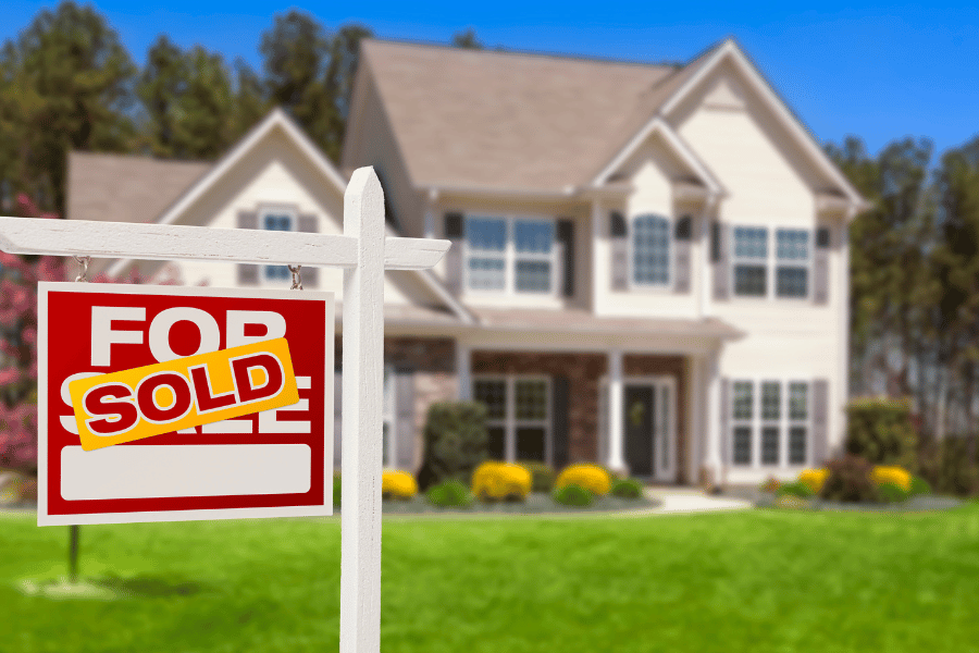 Buying a home sale sign in the yard sold