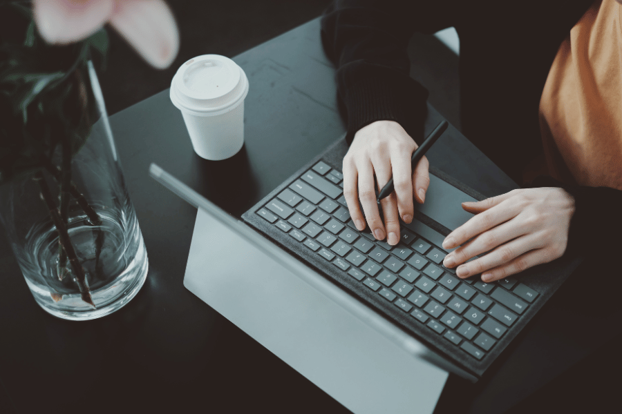 Woman working in a coffee shop on her side hustle