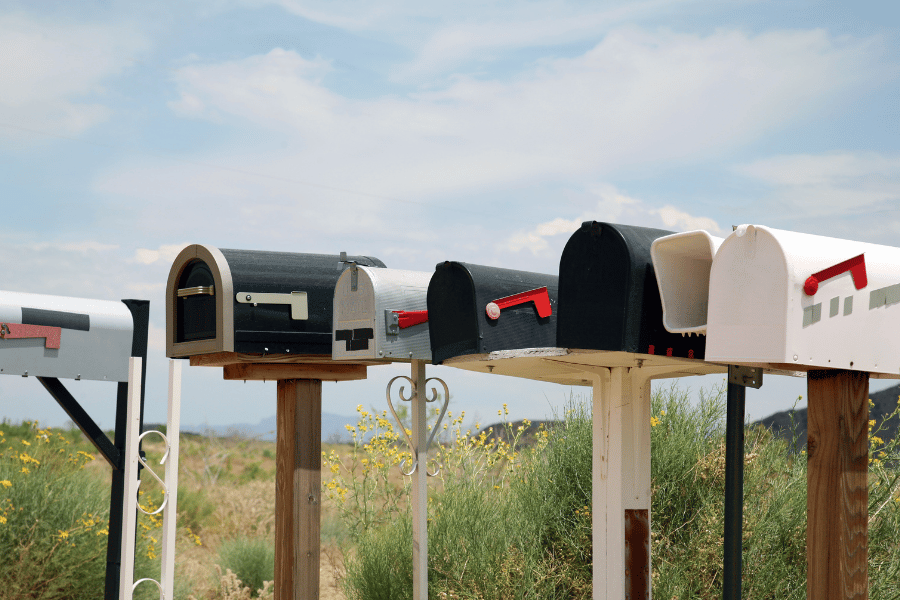 Different colored mailboxes next to each other in a row