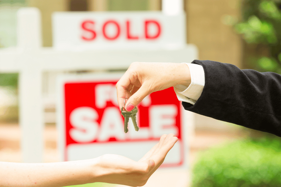 home buyer handed keys to newly bought home 
