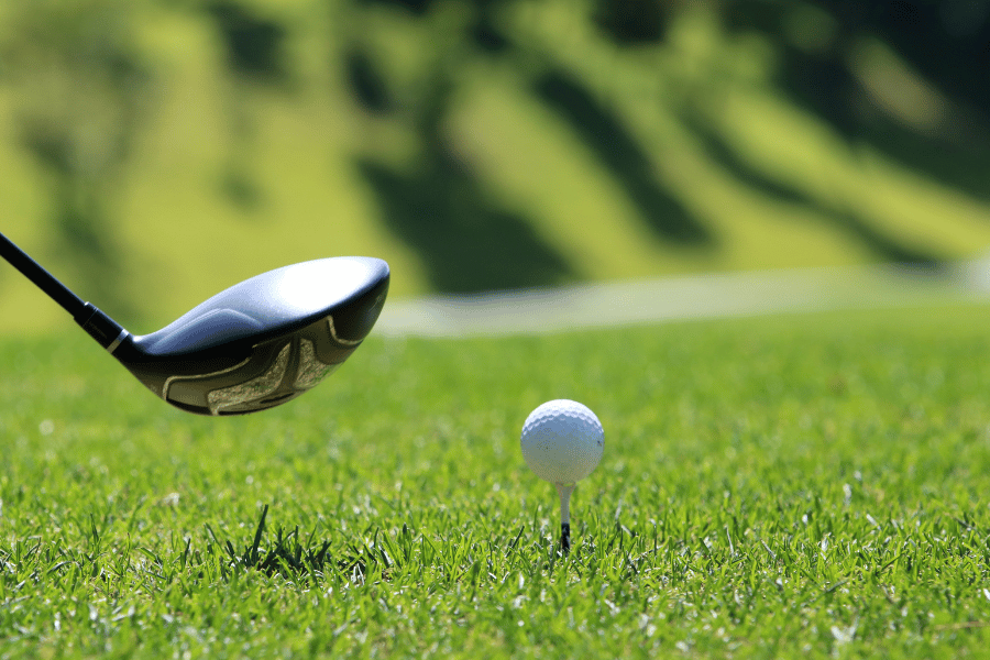 Putting golf ball in the green
