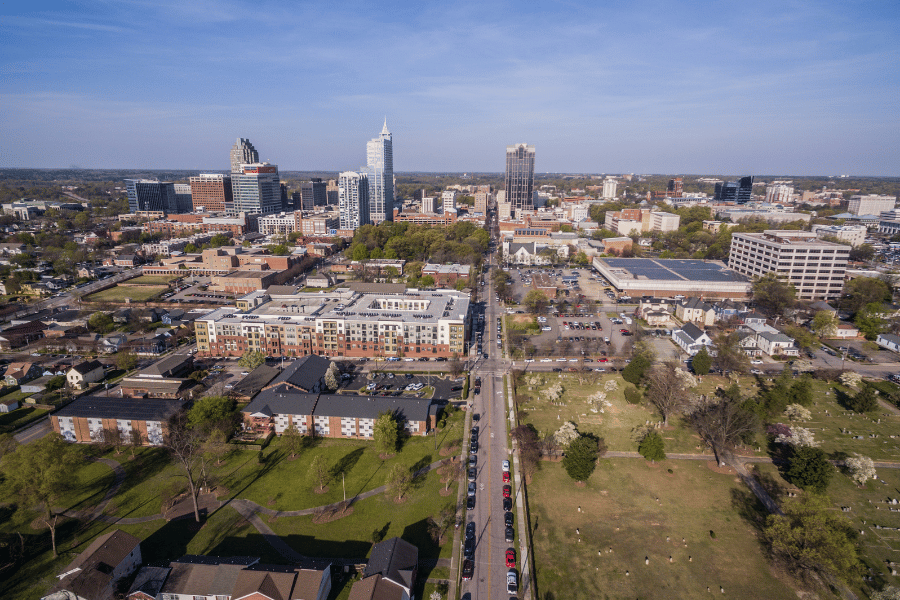 Downtown Raleigh skyline on a sunny day with a view of the buildings and streets