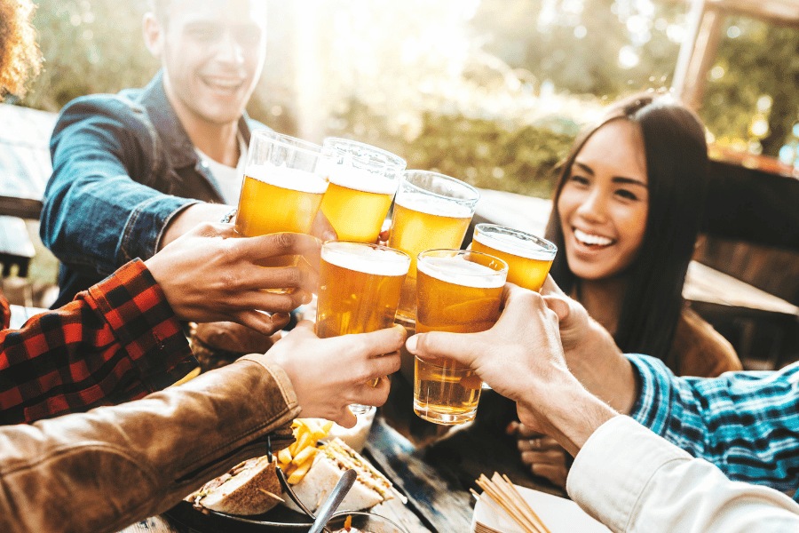 Group of friends enjoying beer and good company at a brewery