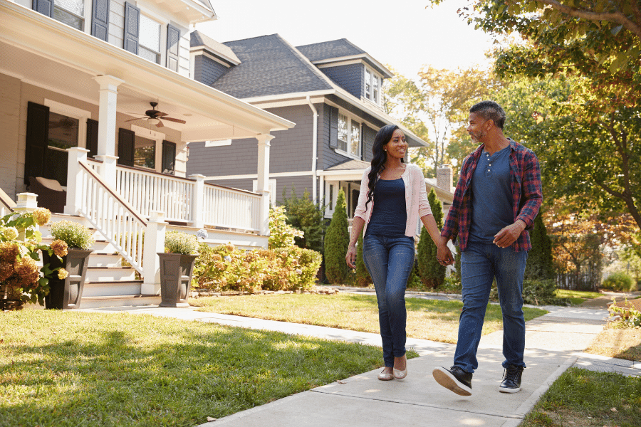 neighbors walking in a suburban neighborhood 
