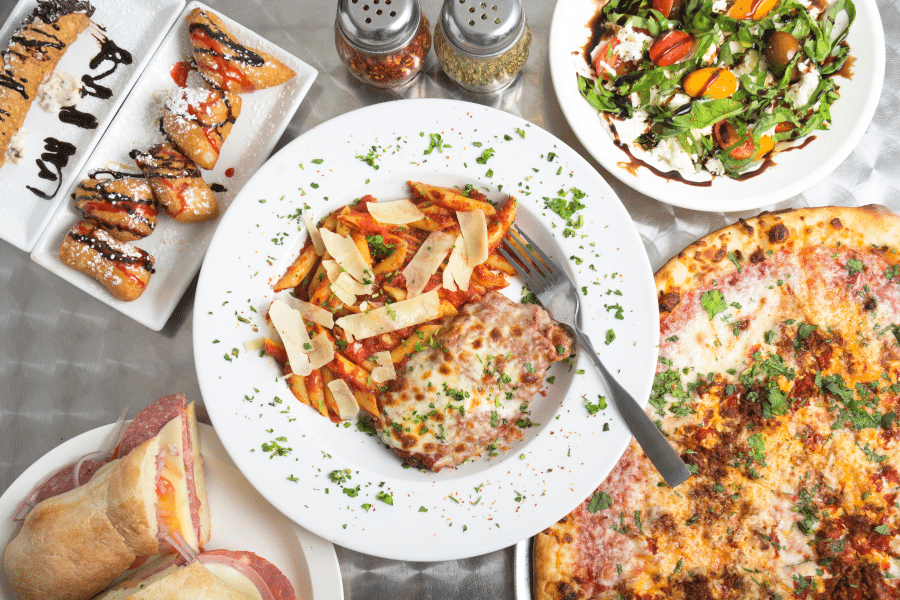 Spread of Italian food with pasta and pizza