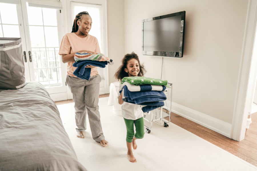 kid helping out around the house with mom when selling a home with kids