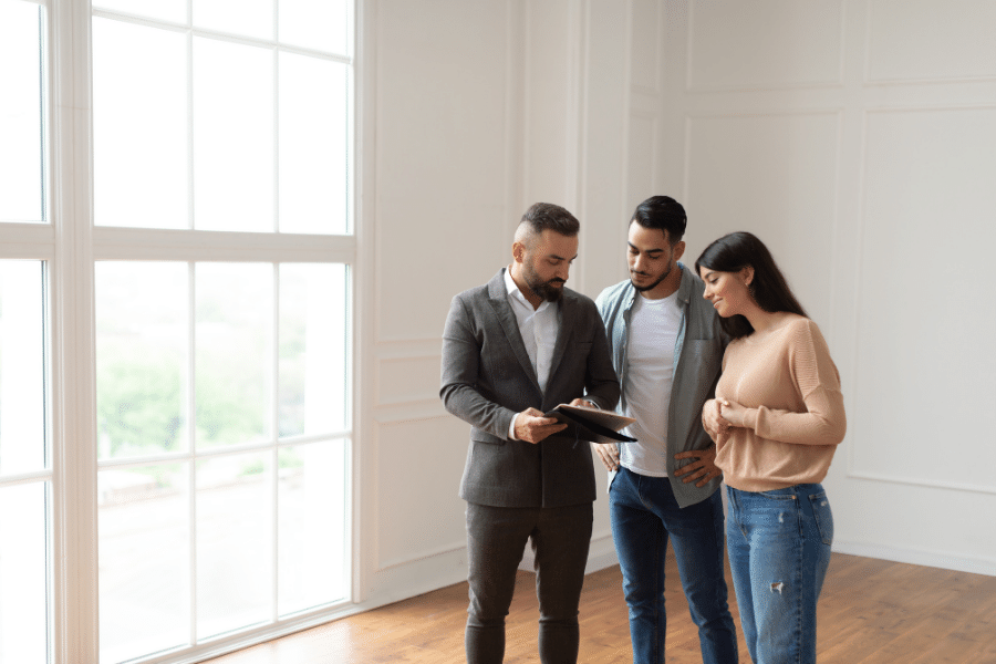 couple looking at and previewing home in person