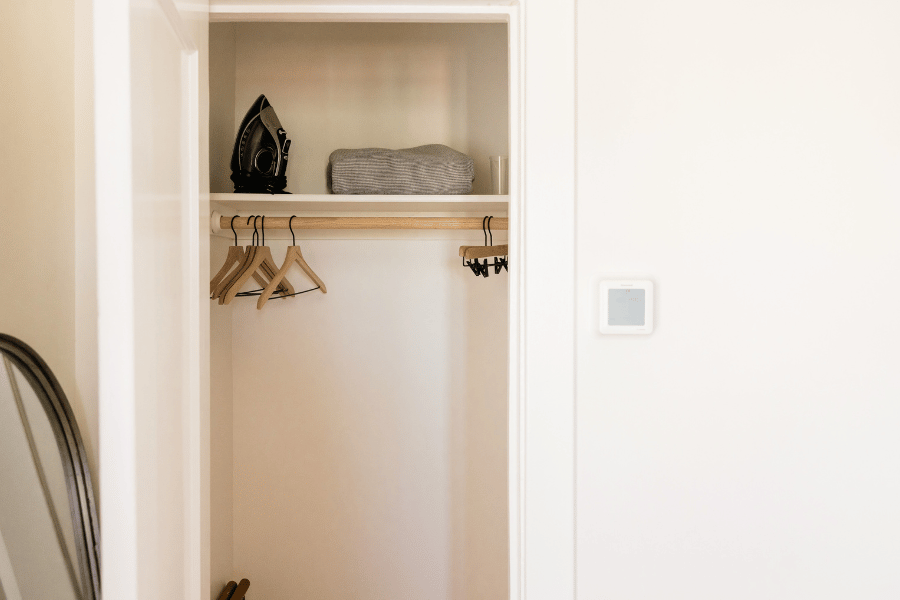 Empty Built in closet with hangers