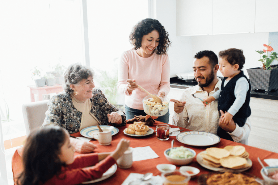 Family dining at home and eating at dining room table