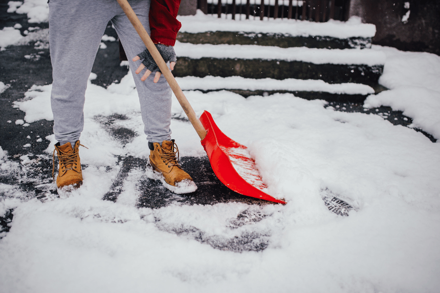 Shoveling snow in the winter at home