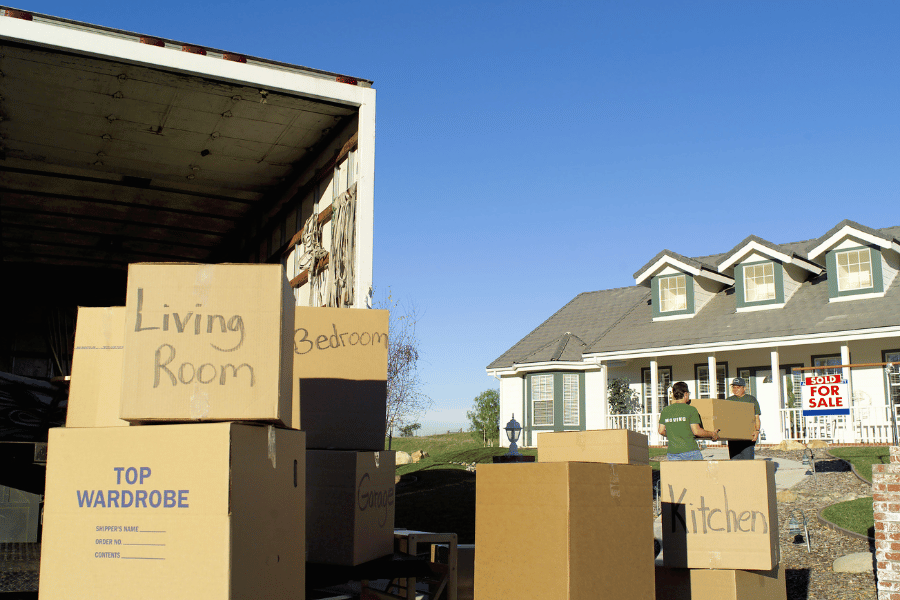 boxes on moving day being loaded into a moving truck