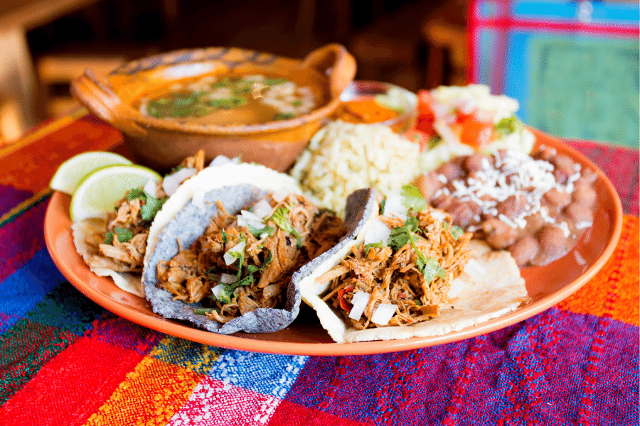 Three tacos with rice and beans 