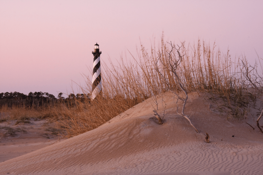 pink sunset and view of a lighthouse in the Outer Banks, North Carolina