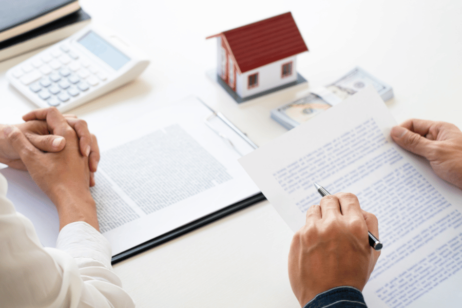 Agent going over the contract with buyers
