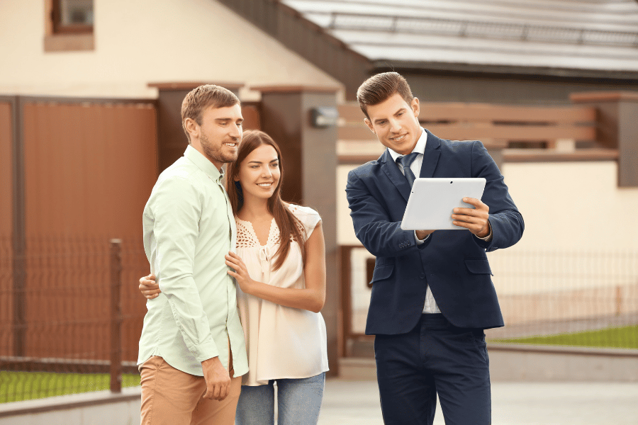 Buyers agent discussing real estate options with clients