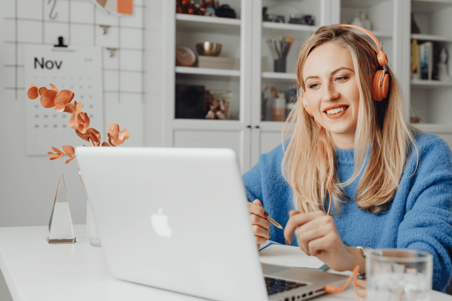 woman working from home wearing an orange headset