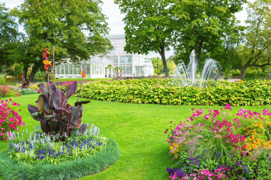 Victorian style garden with shrubs and flowers around