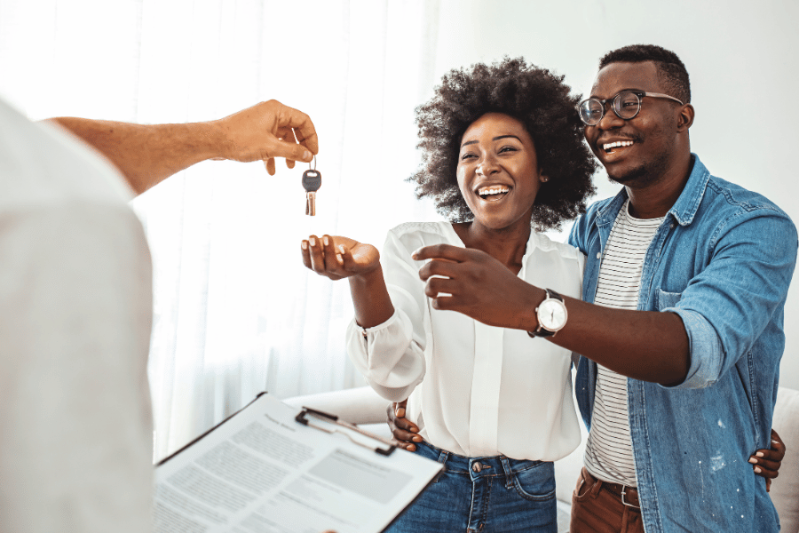 clients closing on a home and receiving their new keys 