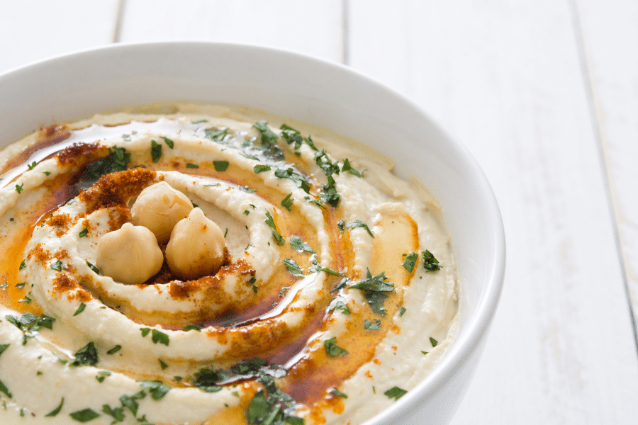 bowl of hummus on a white background