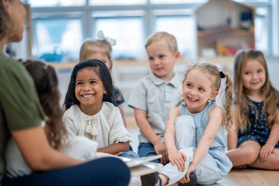 kids sitting together for reading time at daycare 