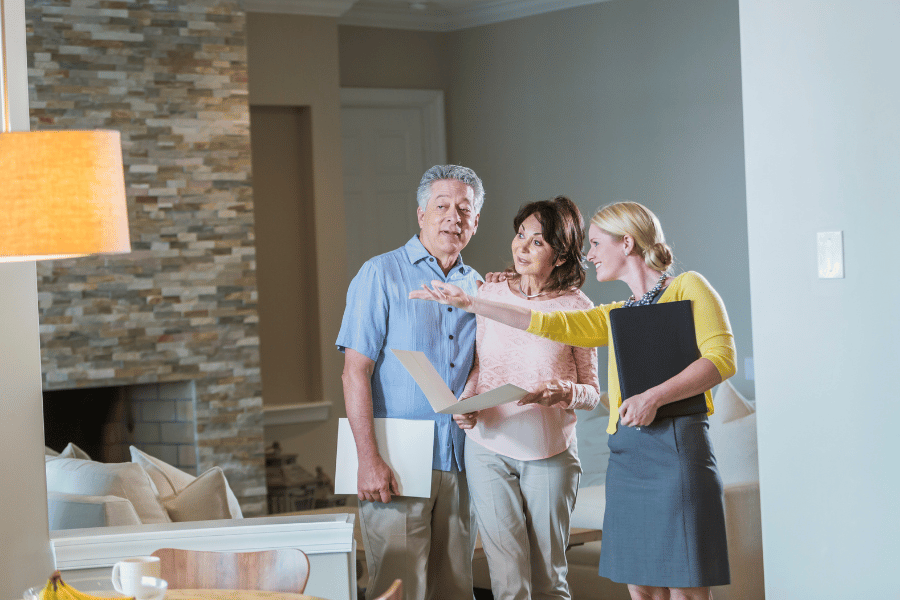 Couple touring a house with their buyer agent