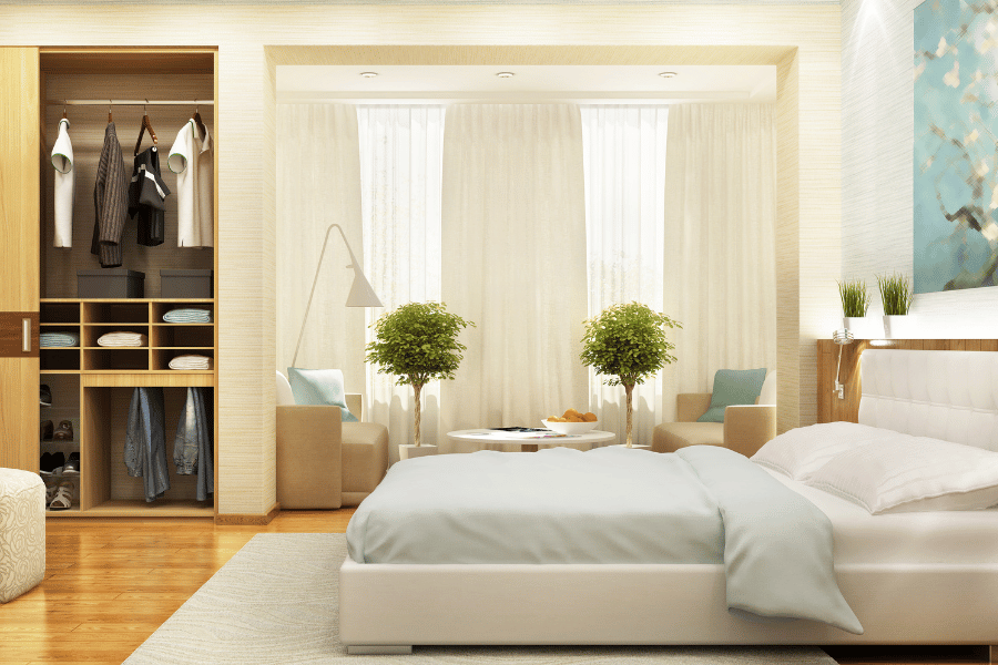 Bedroom with a built in closet in the back